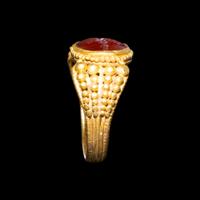 A Late Roman Gold and Carnelian Ring with an Ant Carrying an Ear of Wheat