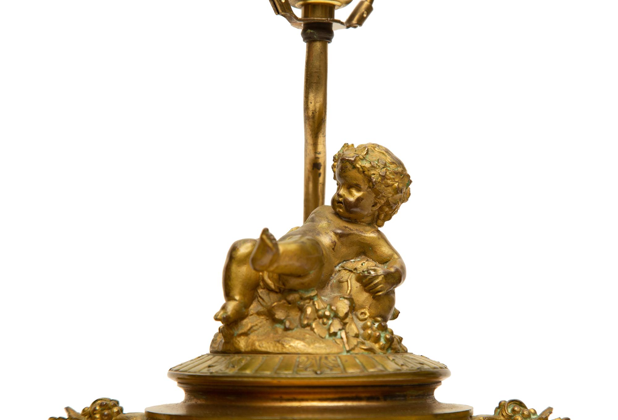 A Pair of Gilt Bronze Mounted Sèvres Style Porcelain Urns Mounted as Lamps