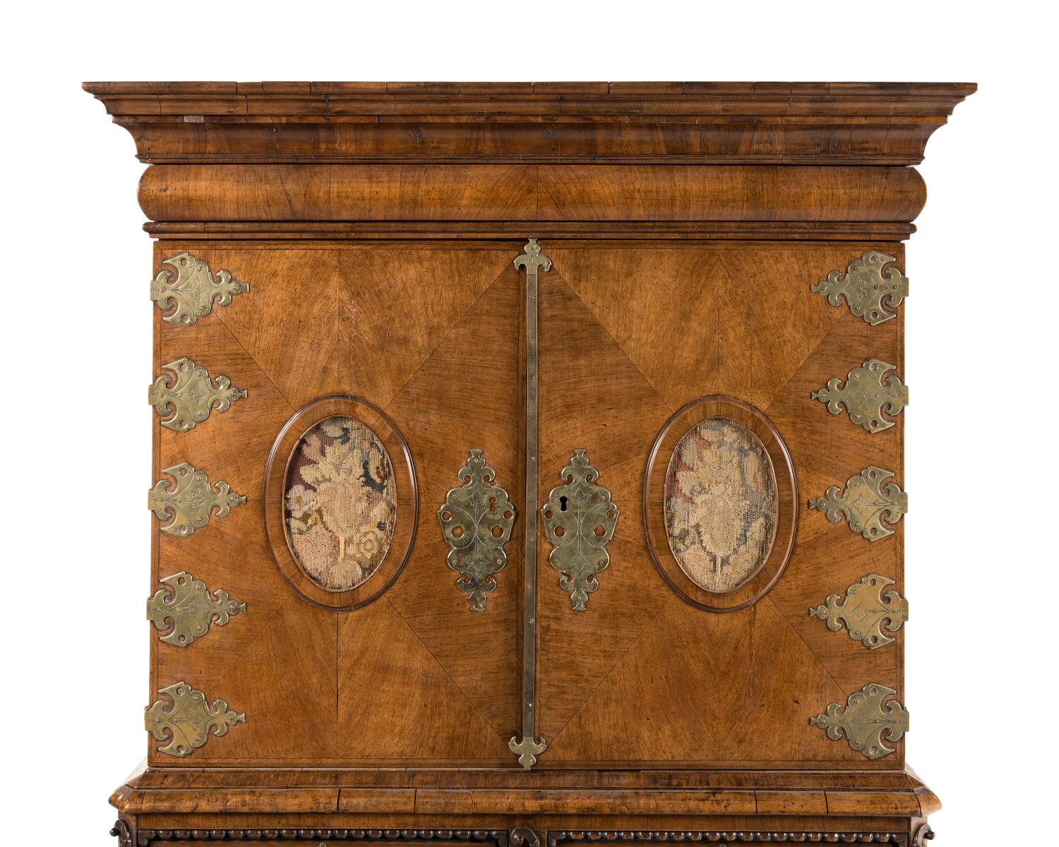 A Continental Baroque Brass Mounted Walnut Cabinet on Chest