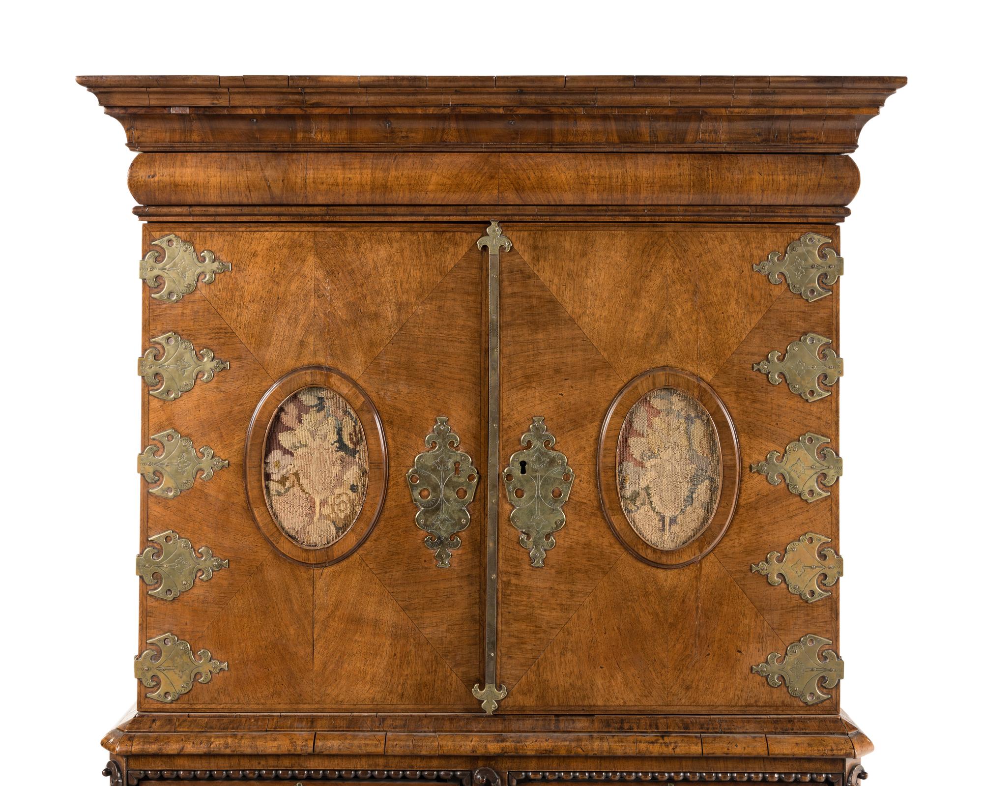 A Continental Baroque Brass Mounted Walnut Cabinet on Chest