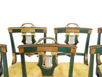 A Set of Eight Continental Green Painted and Parcel Gilt Lyre-Back Dining Chairs