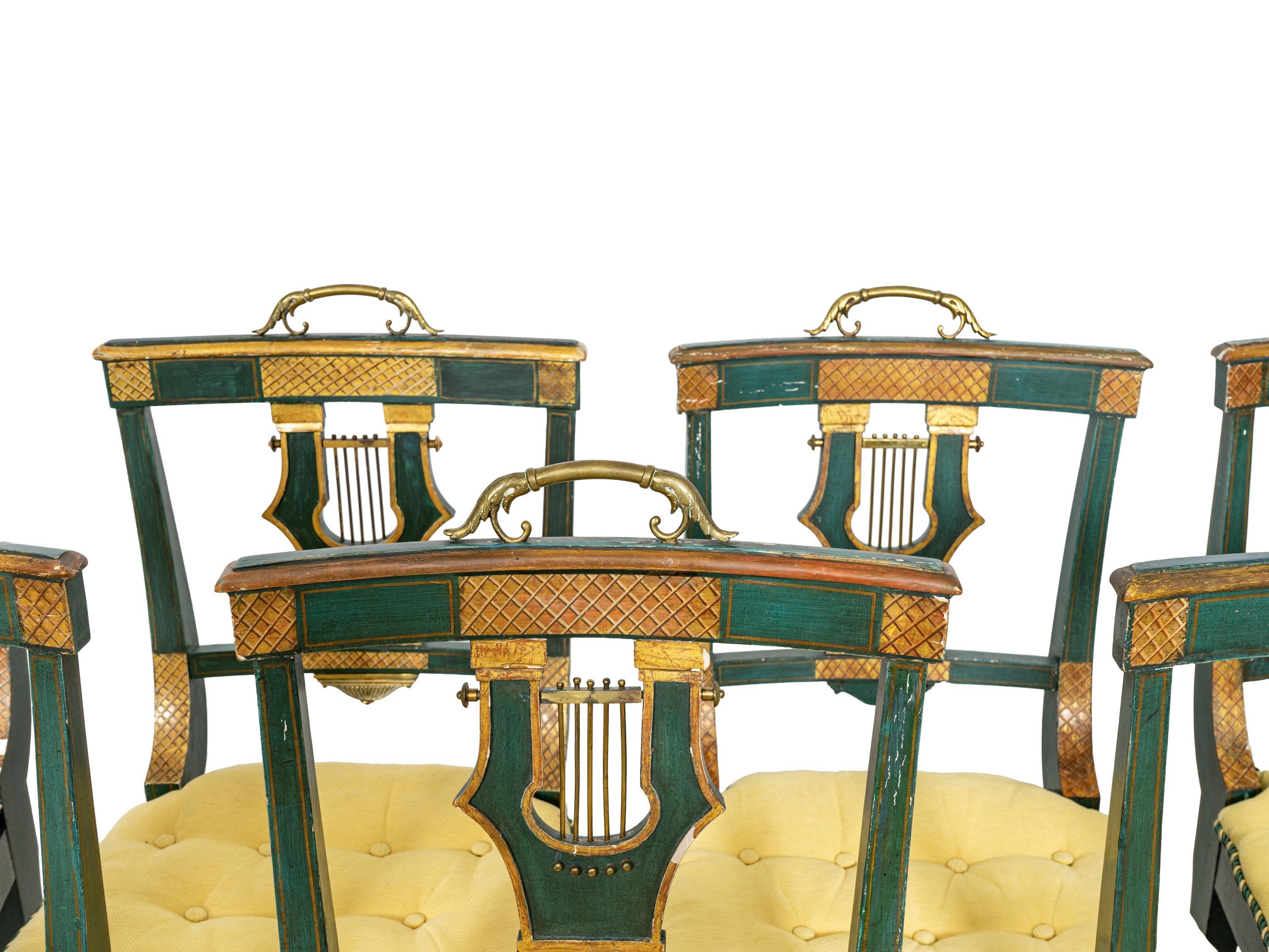 A Set of Eight Continental Green Painted and Parcel Gilt Lyre-Back Dining Chairs