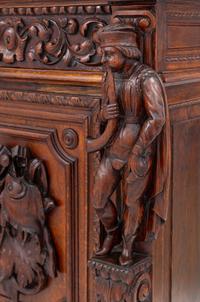 A Swiss Black Forest Carved Hunt Cabinet