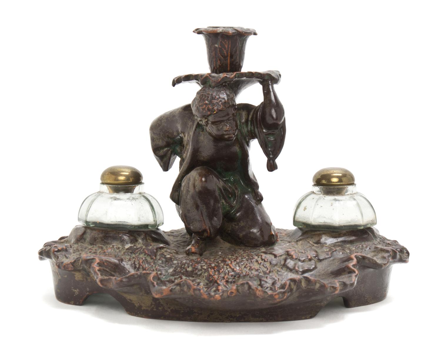 A Continental Terracotta Figural Inkwell, Height 7 inches.