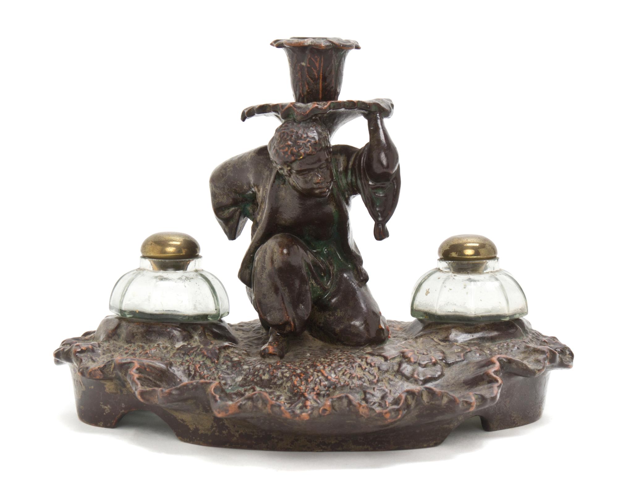 A Continental Terracotta Figural Inkwell, Height 7 inches.