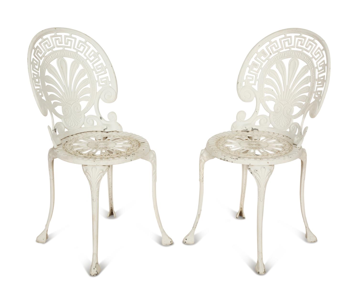 A Pair of White Painted Cast Metal Garden Chairs
