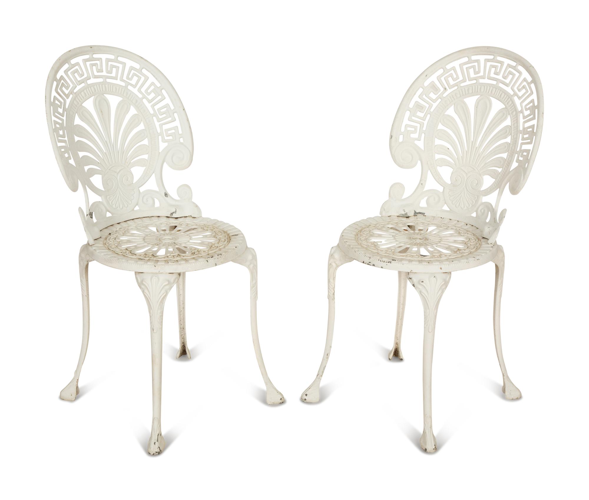 A Pair of White Painted Cast Metal Garden Chairs