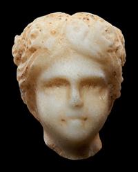 A Roman Marble Head of a Muse, Possibly Flora