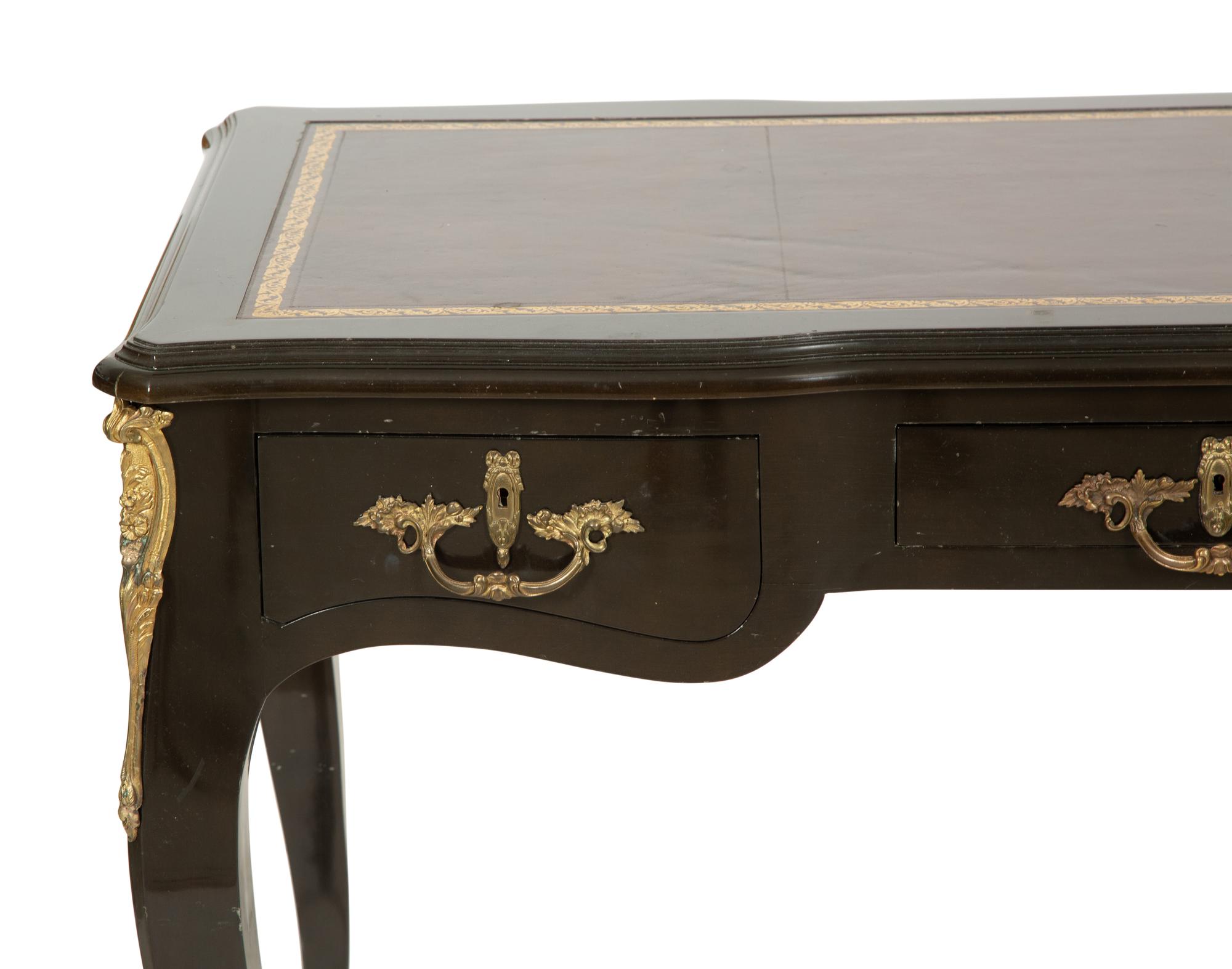 A Louis XV Style Gilt Metal-Mounted Ebonized Bureau Plat