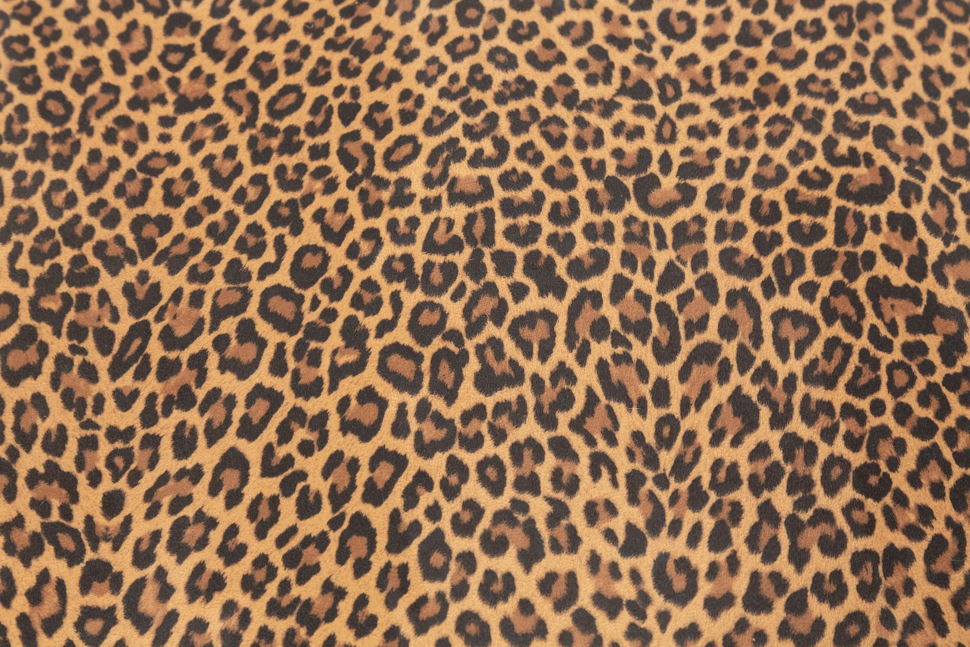 A Louis XIV Carved Walnut Tabouret with Leopard Print Upholstery