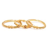 COLLECTION OF YELLOW GOLD BANGLE BRACELETS