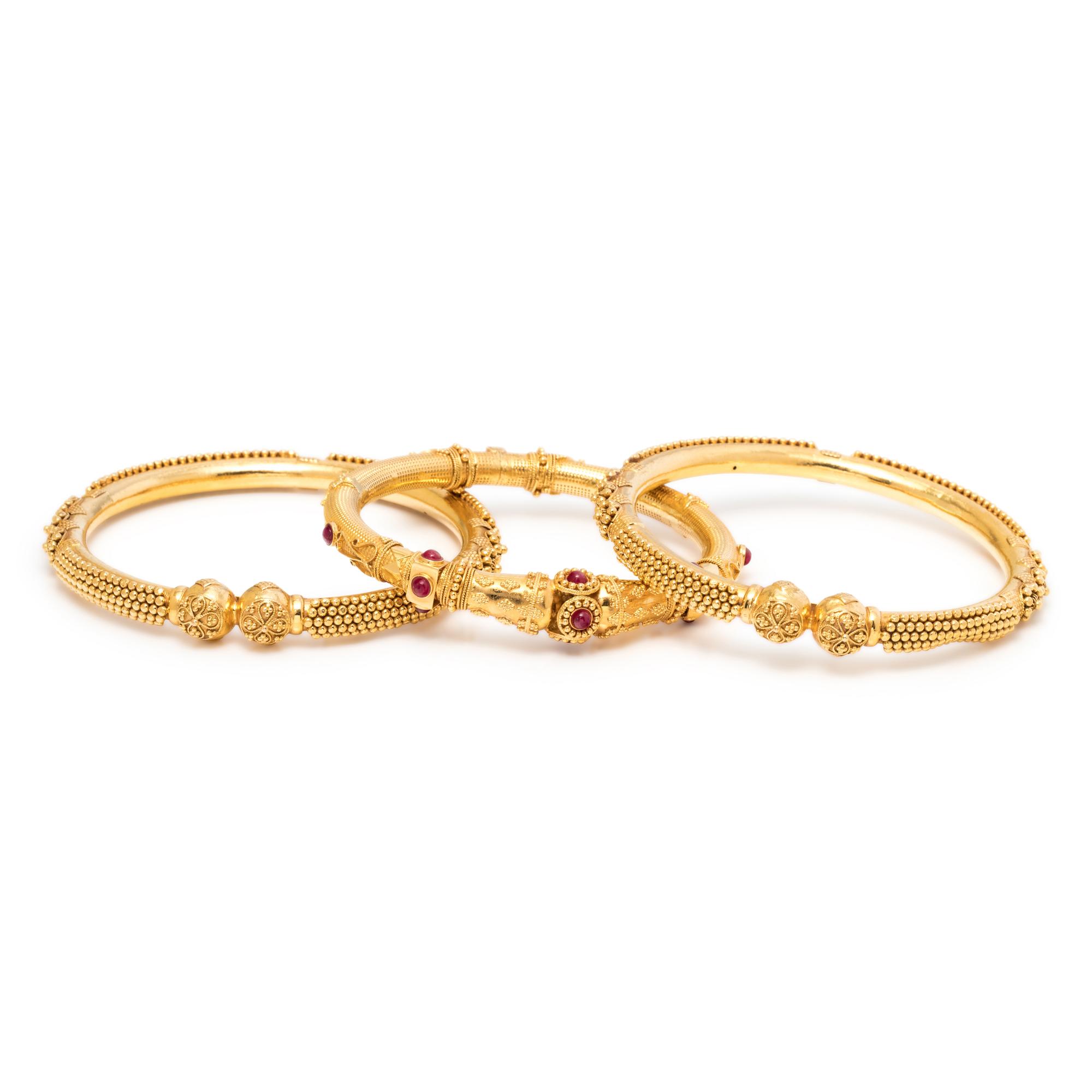 COLLECTION OF YELLOW GOLD BANGLE BRACELETS