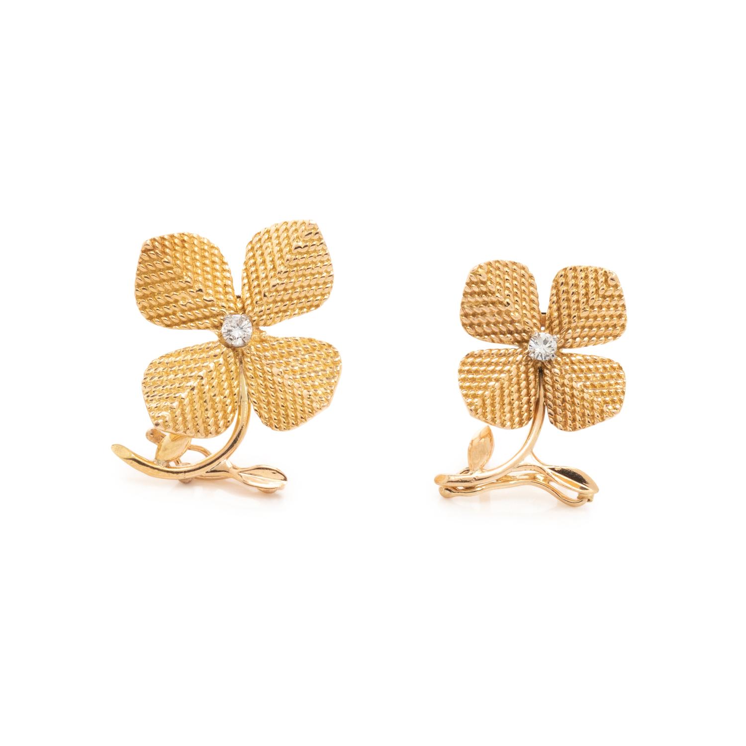 COLLECTION OF DIAMOND FLORAL BROOCHES