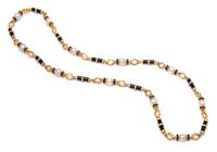 A Yellow Gold, Cultured South Sea Pearl, Diamond and Onyx Longchain Necklace, 131.00 dwts.