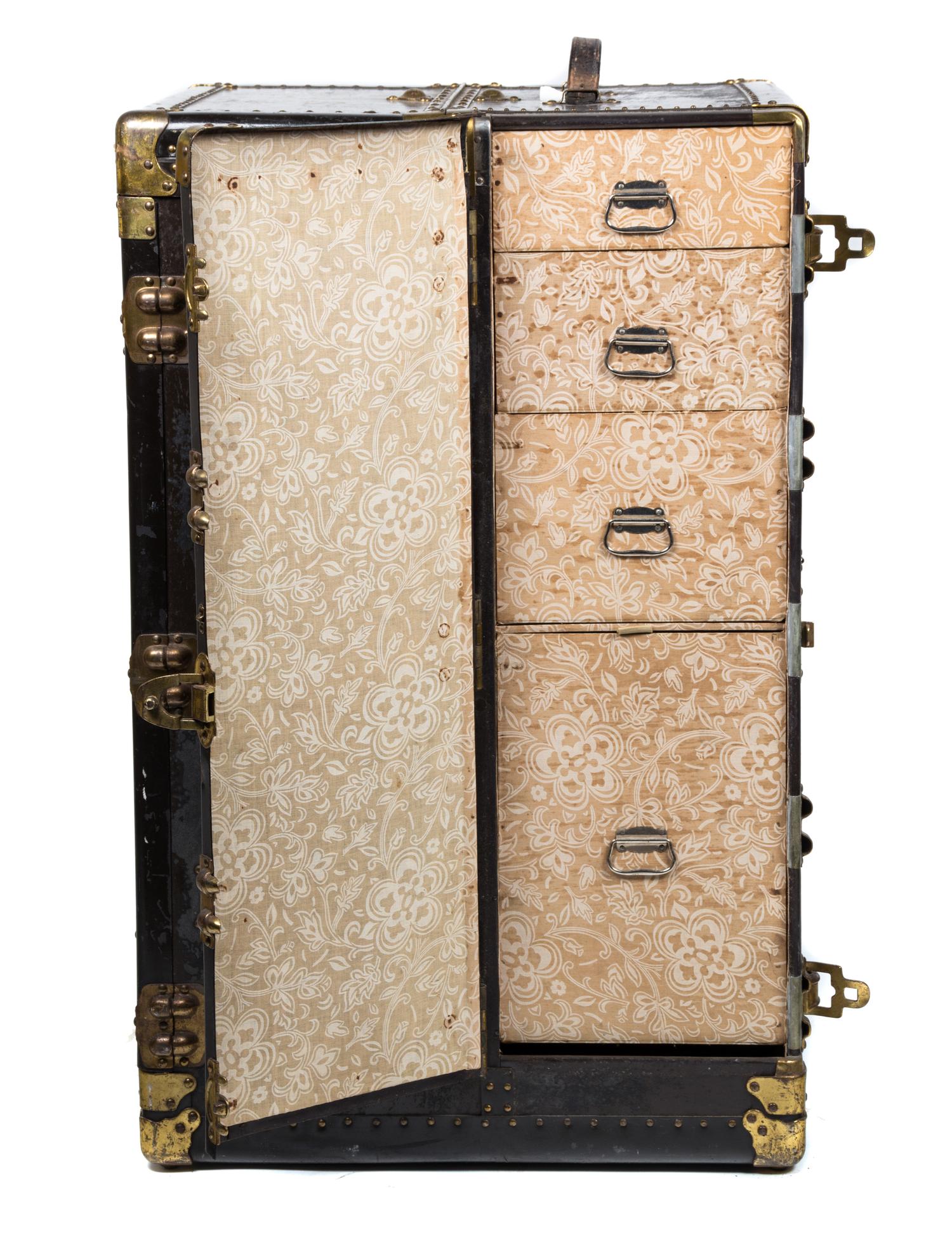 A Brass Mounted Black Steamer Trunk Height 25 x width 39 x depth 22 inches.