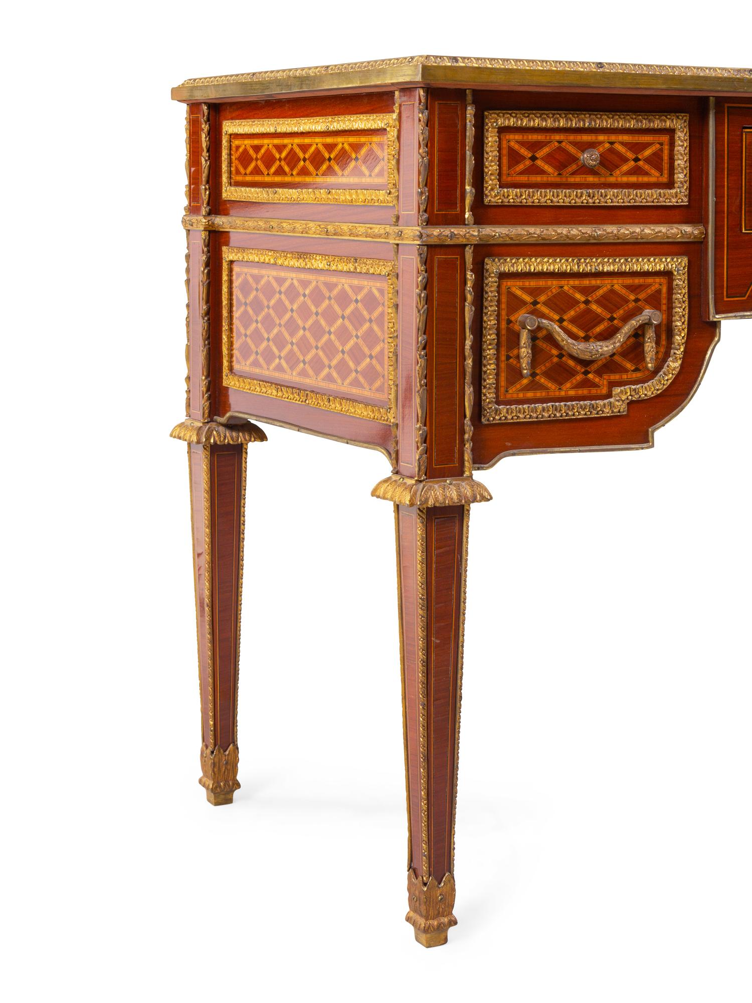 A Louis XVI Style Gilt Bronze Mounted Parquetry Bureau Plat