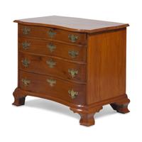 A Chippendale Cherry Oxbow Chest of Drawers