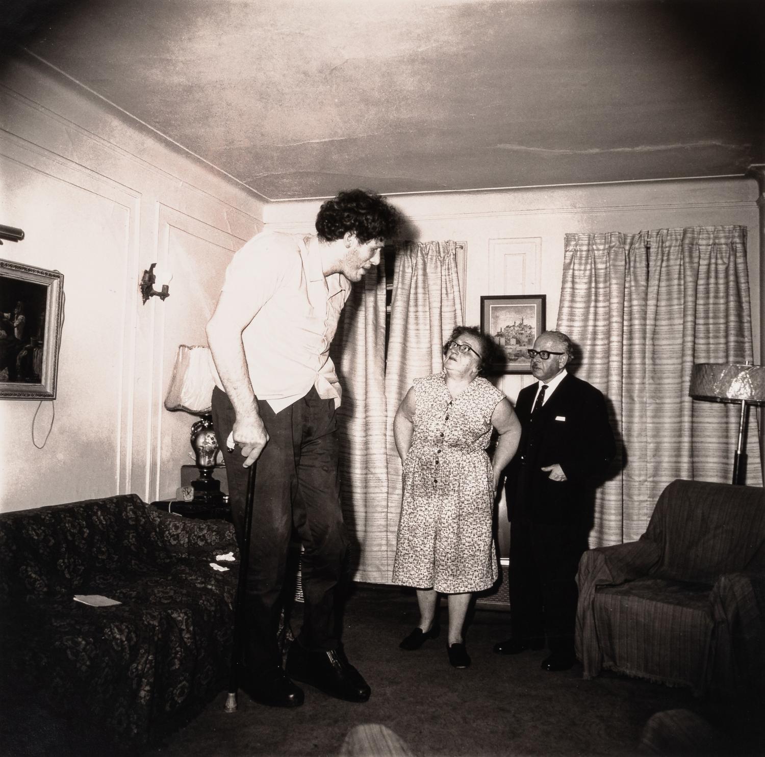 Diane Arbus (1923-1971) A Jewish giant at home with his parents in the Bronx, N.Y., 1970, from "A box of ten photographs," 1969-1973