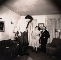 Diane Arbus (1923-1971) A Jewish giant at home with his parents in the Bronx, N.Y., 1970, from "A box of ten photographs," 1969-1973