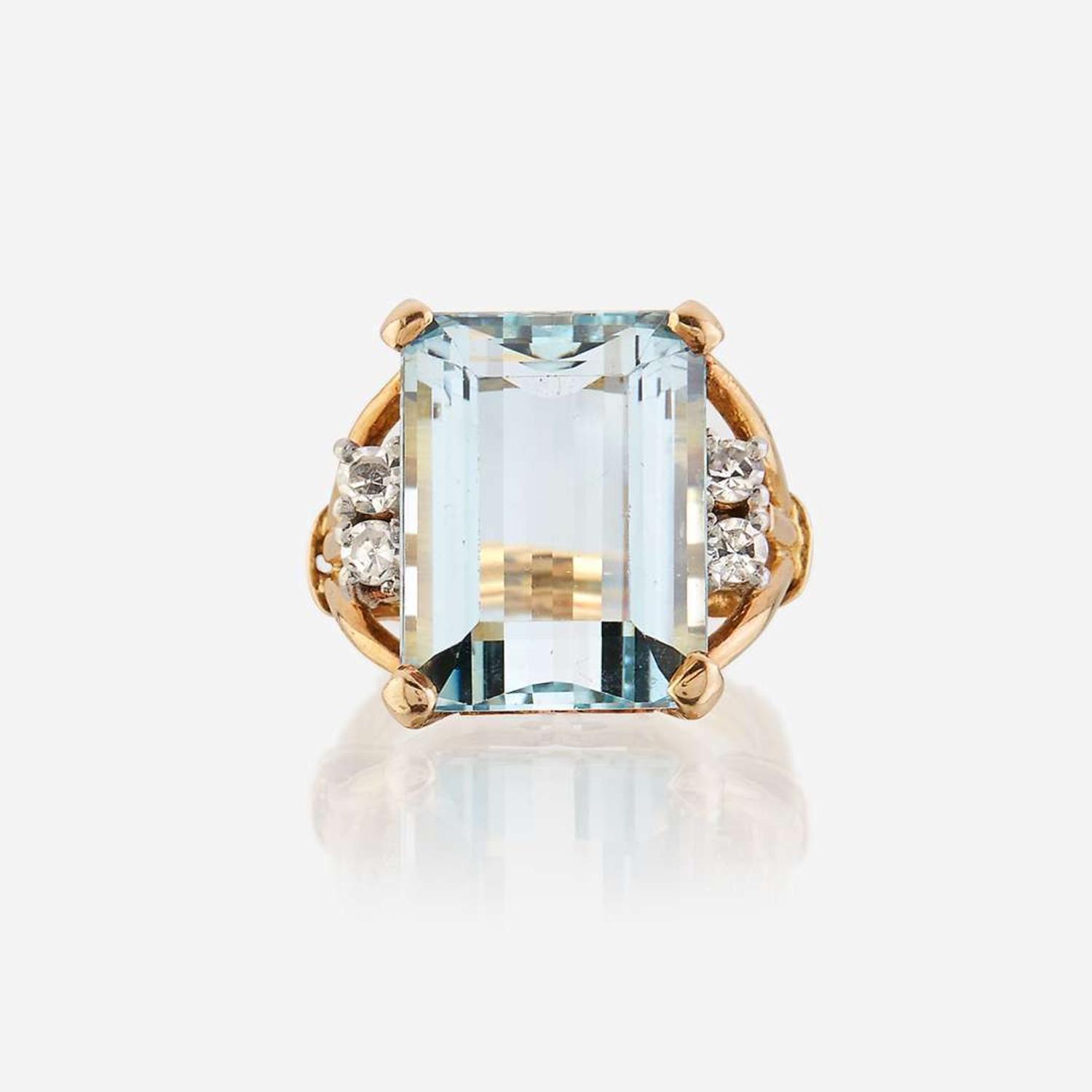 An aquamarine, diamond, and eighteen karat gold ring