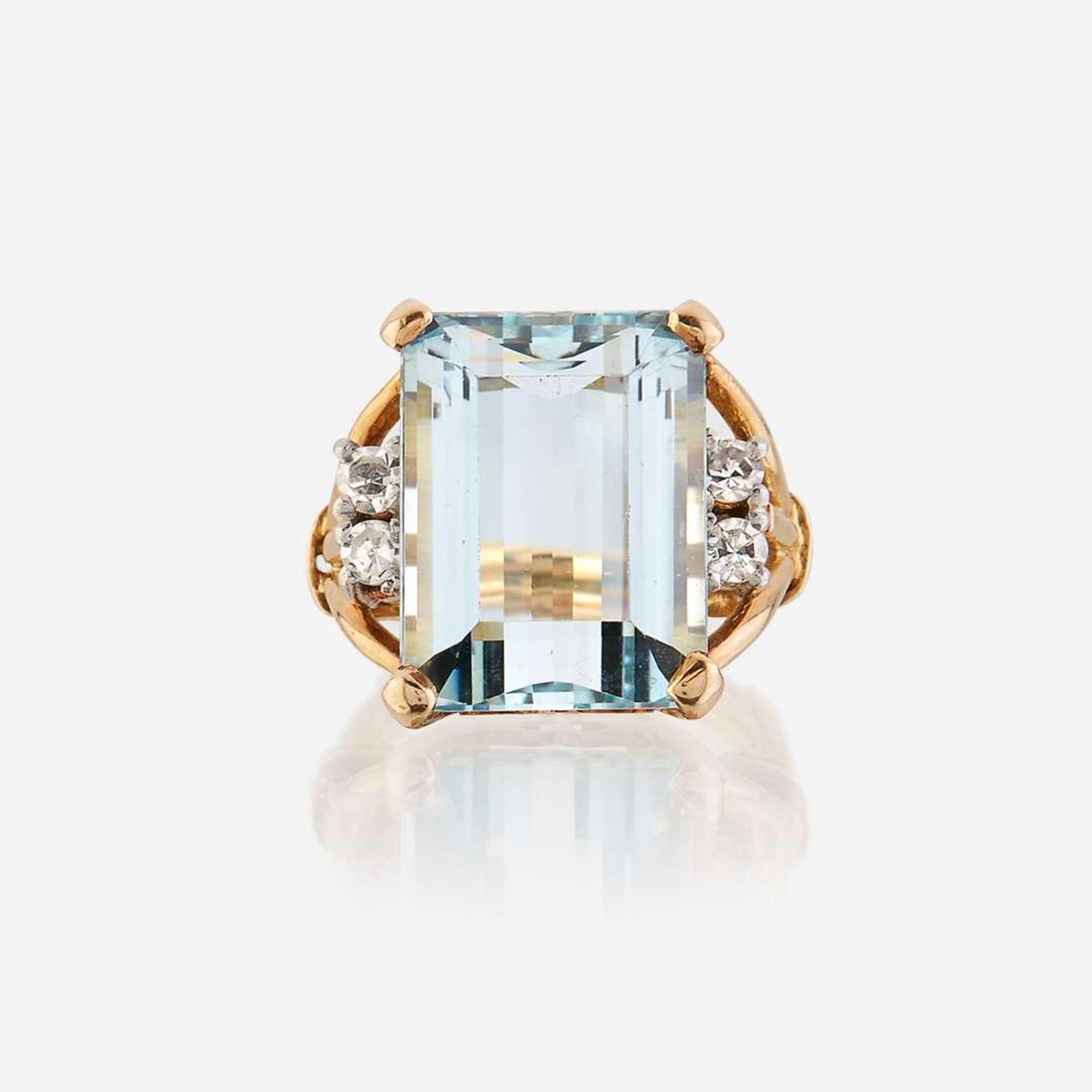 An aquamarine, diamond, and eighteen karat gold ring