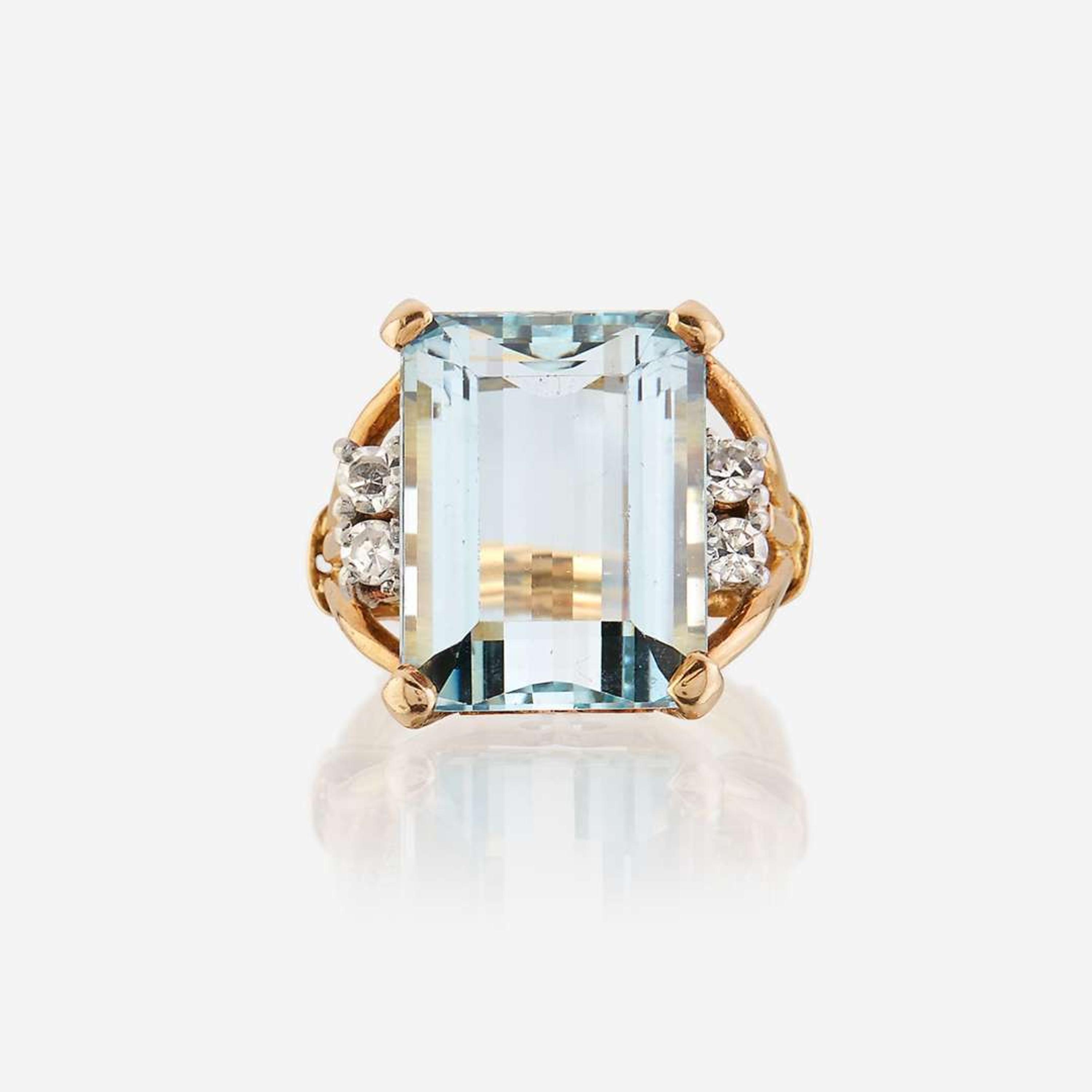 An aquamarine, diamond, and eighteen karat gold ring