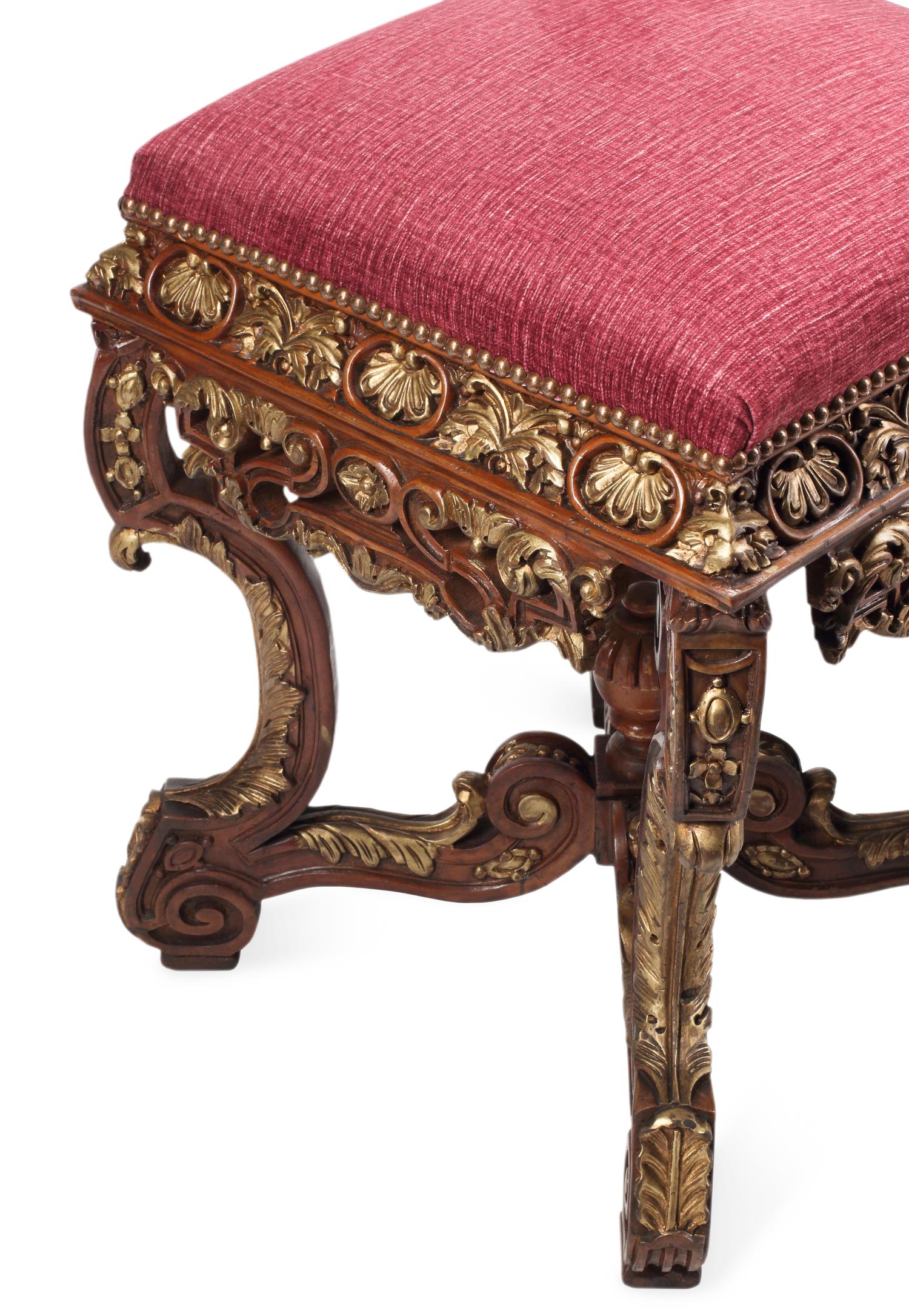 A Pair of Régence Style Carved and Parcel Gilt Stools