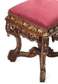 A Pair of Régence Style Carved and Parcel Gilt Stools