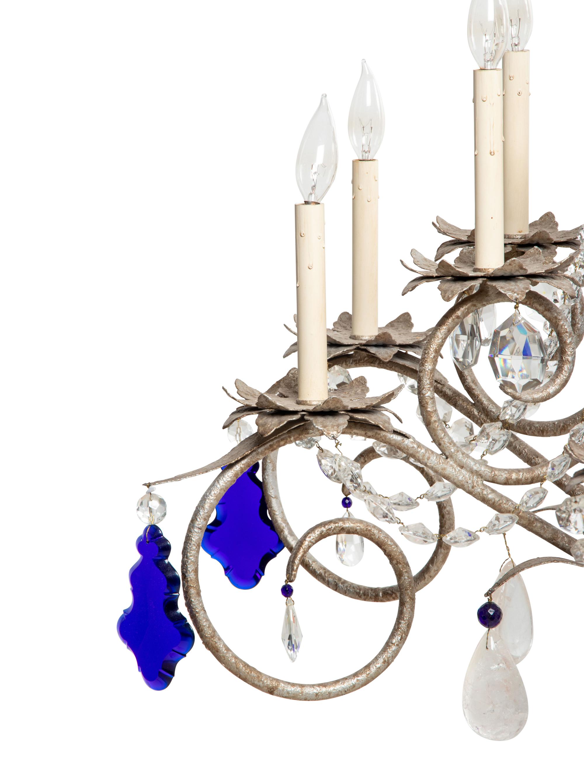 A Set of Three Large Metal and Glass Sixteen-Light Chandeliers