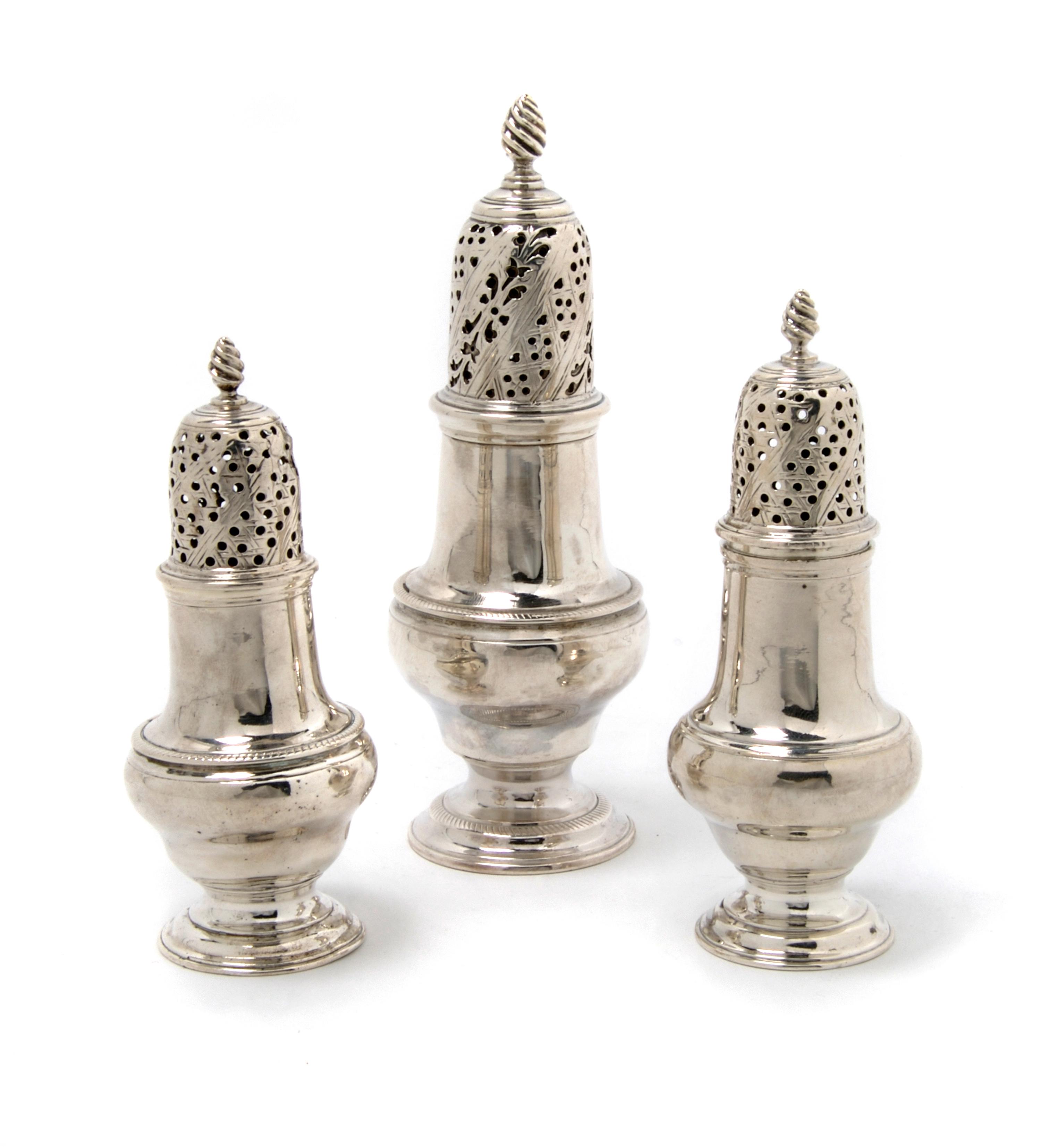 A Group of Three Georgian Silver Casters, London, Height of tallest 6 inches.