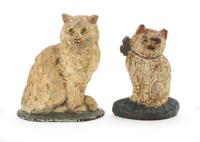 Two Cast Iron Doorstops Height of tallest 8 3/4 inches.