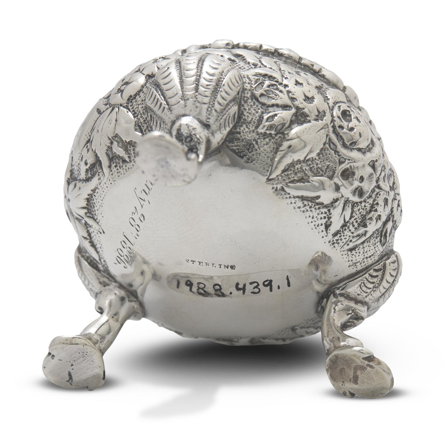 A Pair of Sterling Silver Floral Repousse Salt Cellars