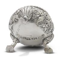 A Pair of Sterling Silver Floral Repousse Salt Cellars