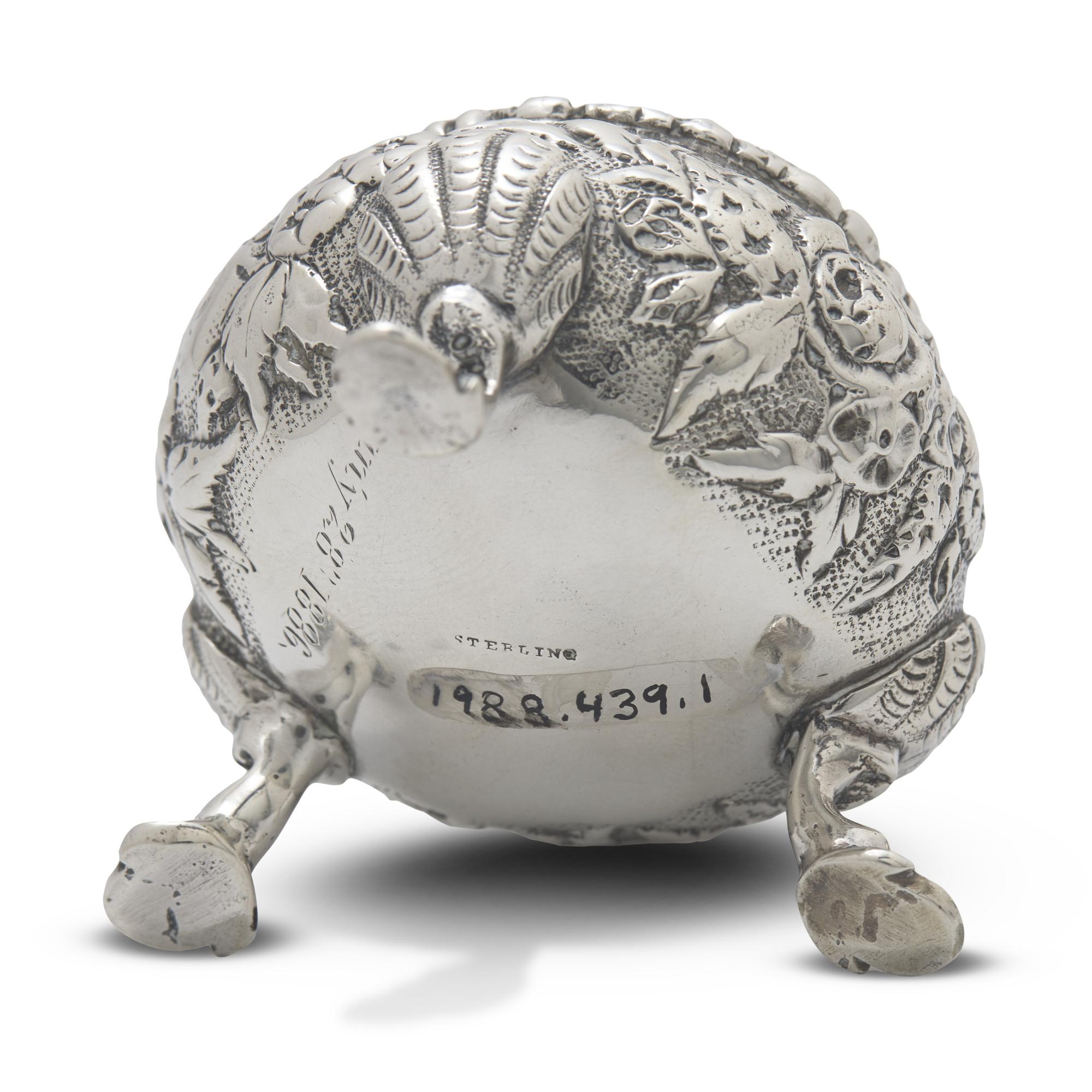 A Pair of Sterling Silver Floral Repousse Salt Cellars