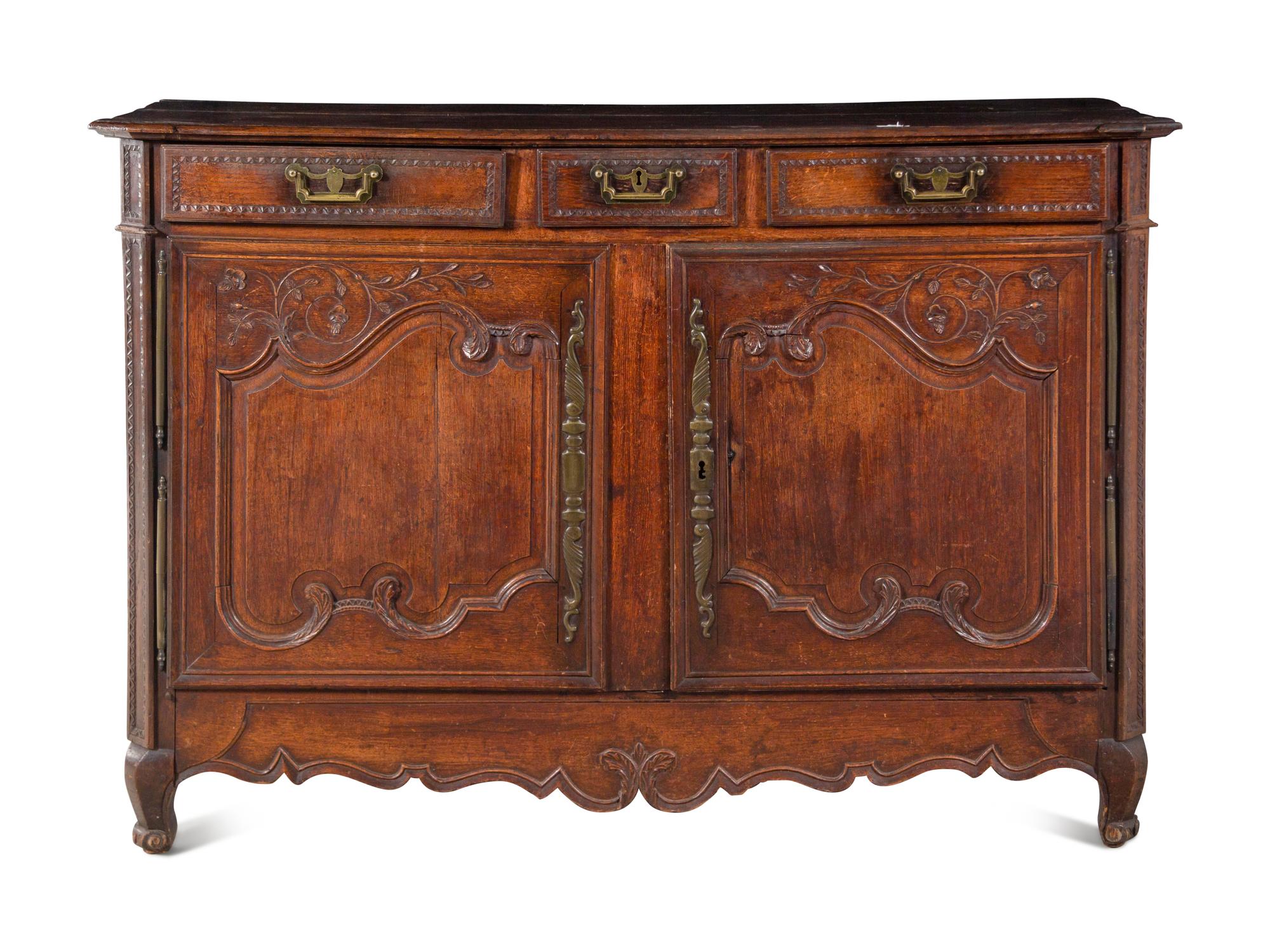 A French Provincial Carved Oak Cabinet