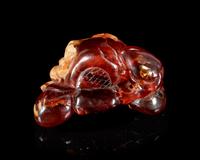 A Carved Amber Hand Citron-Form Snuff Bottle