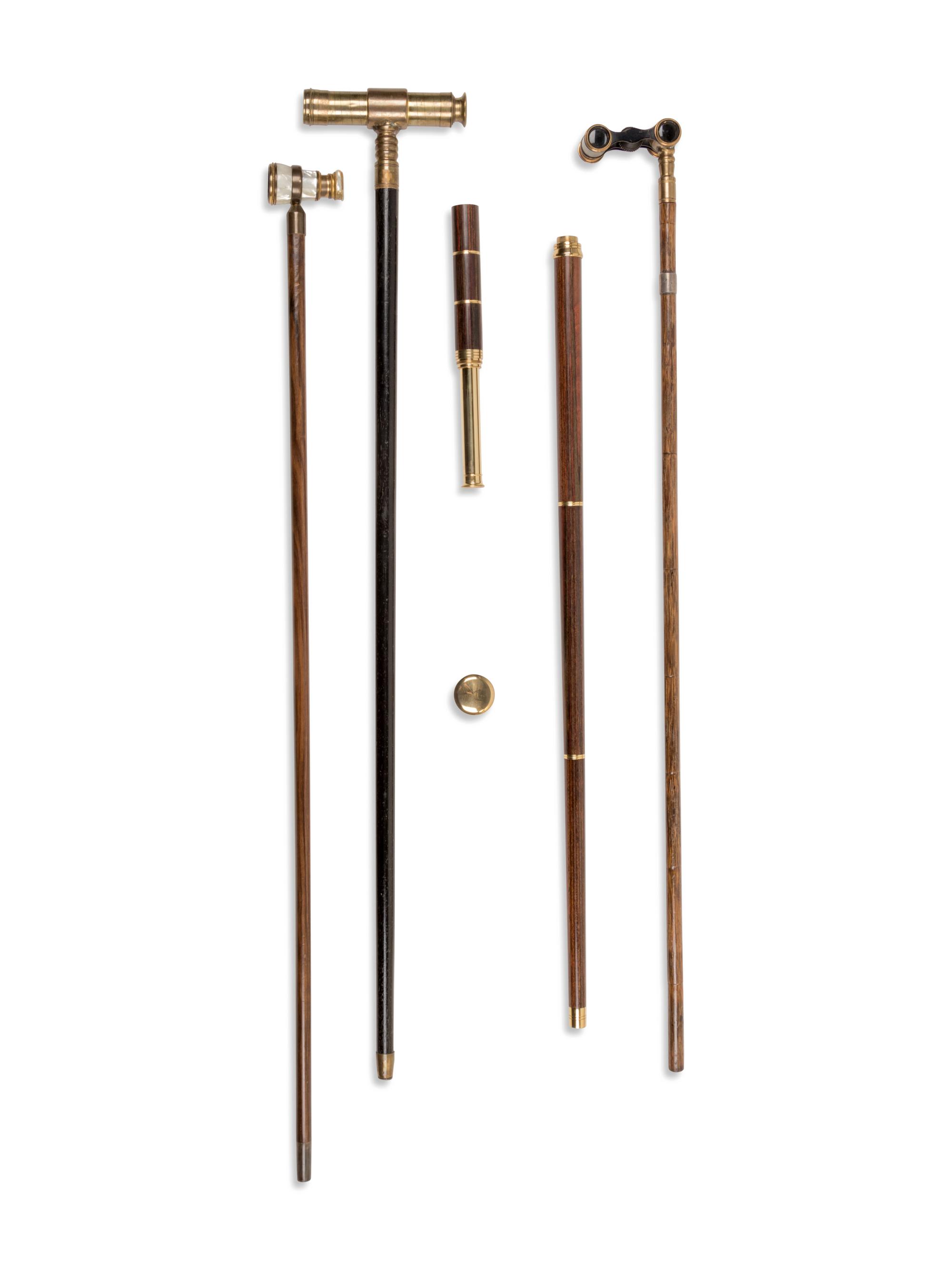Four Brass-Mounted Optical System Walking Sticks