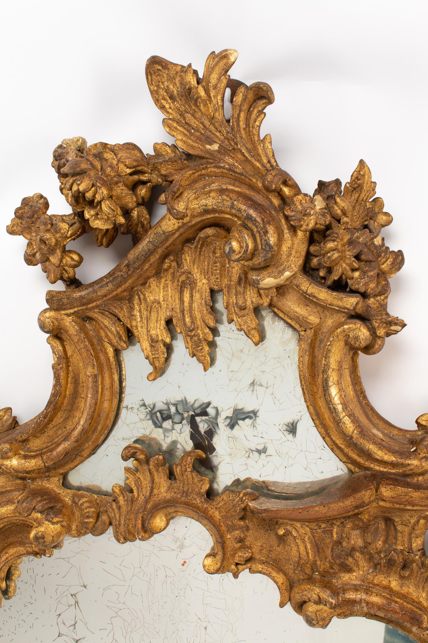 A Pair of Italian Carved Giltwood Girandole Mirrors
