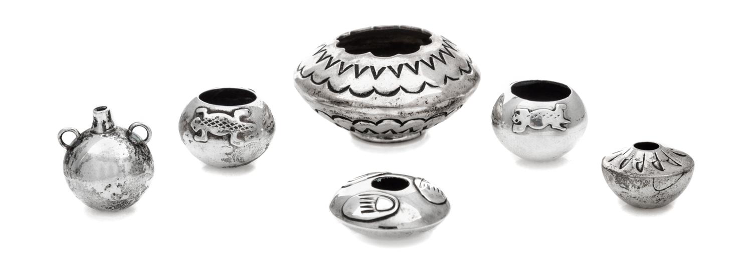 A Group of Five Native American Silver Vessels, , comprising a pair of bowls with applied lizard decoration, a fan-decorated bowl, a tw