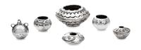 A Group of Five Native American Silver Vessels, , comprising a pair of bowls with applied lizard decoration, a fan-decorated bowl, a tw