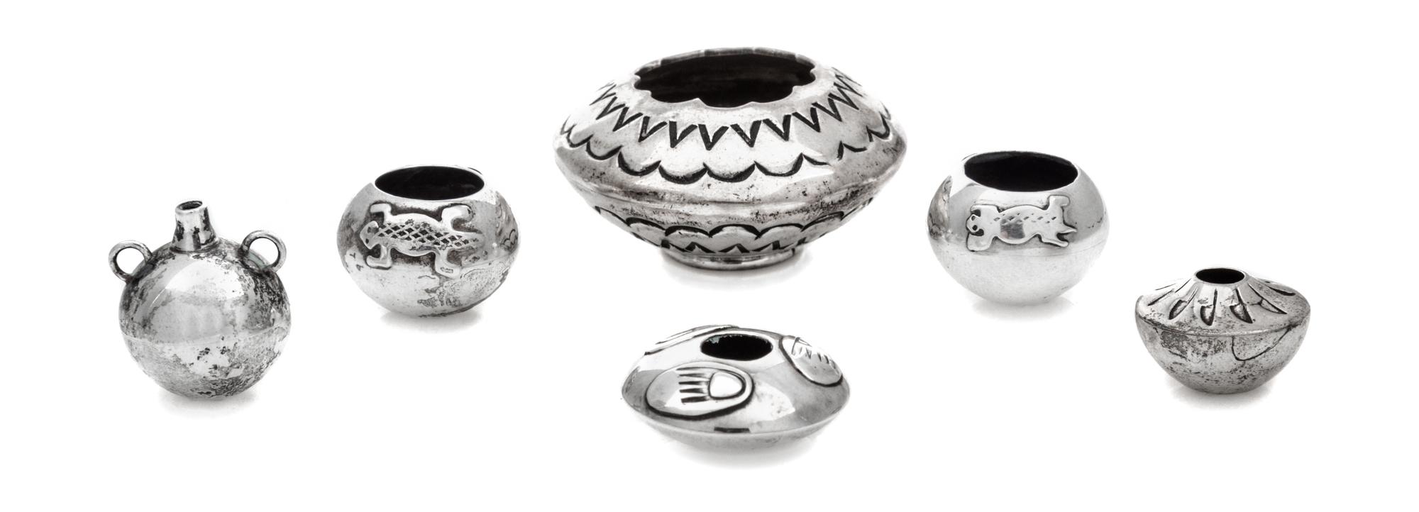 A Group of Five Native American Silver Vessels, , comprising a pair of bowls with applied lizard decoration, a fan-decorated bowl, a tw