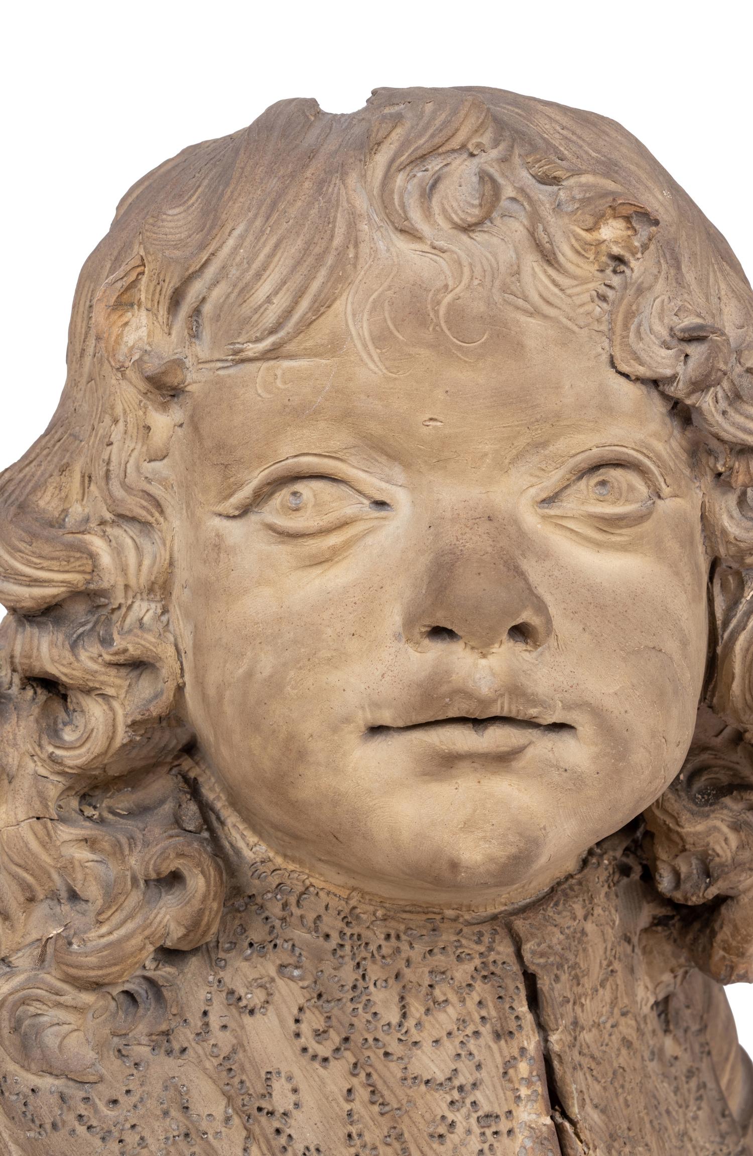 A Continental Terra Cotta Bust of a Boy