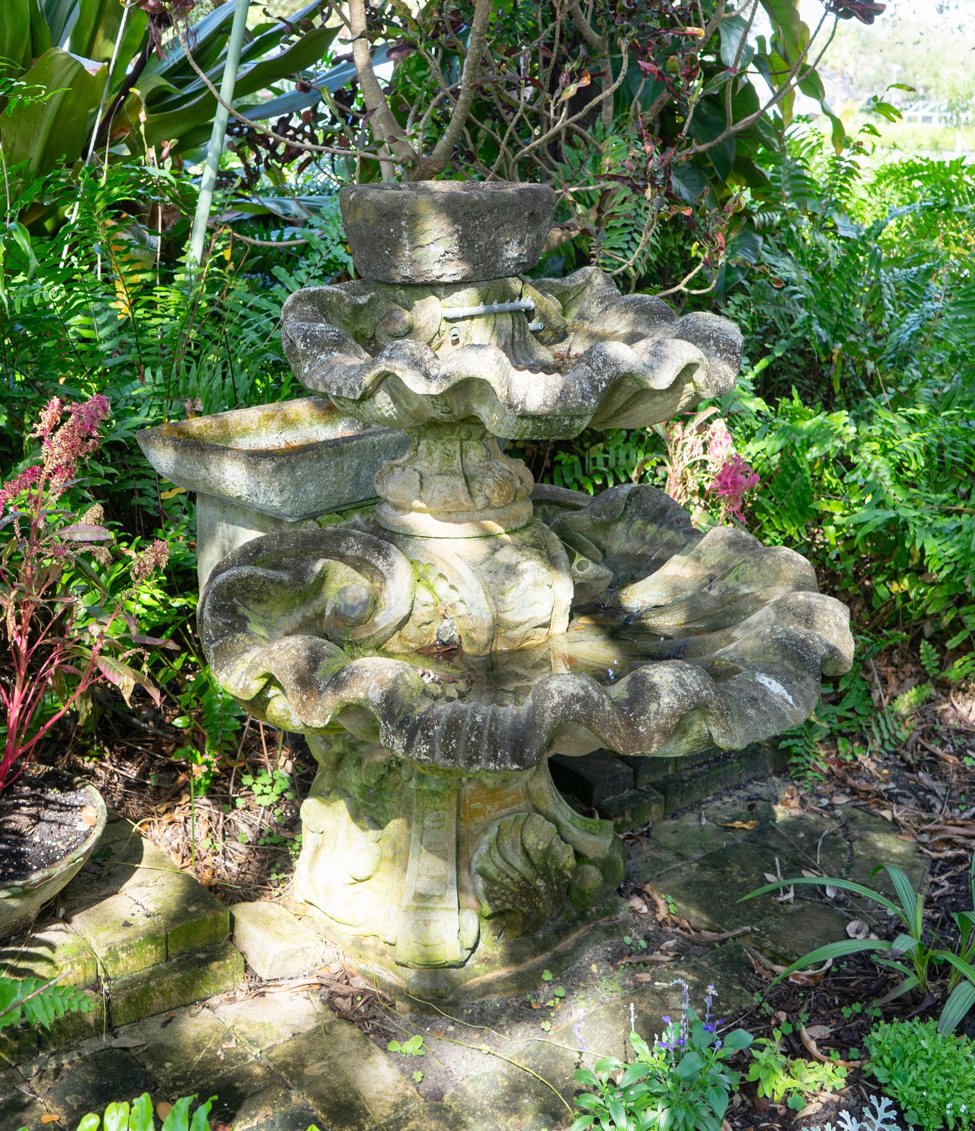 A Carved Stone Two Tier Shell Water Fountain