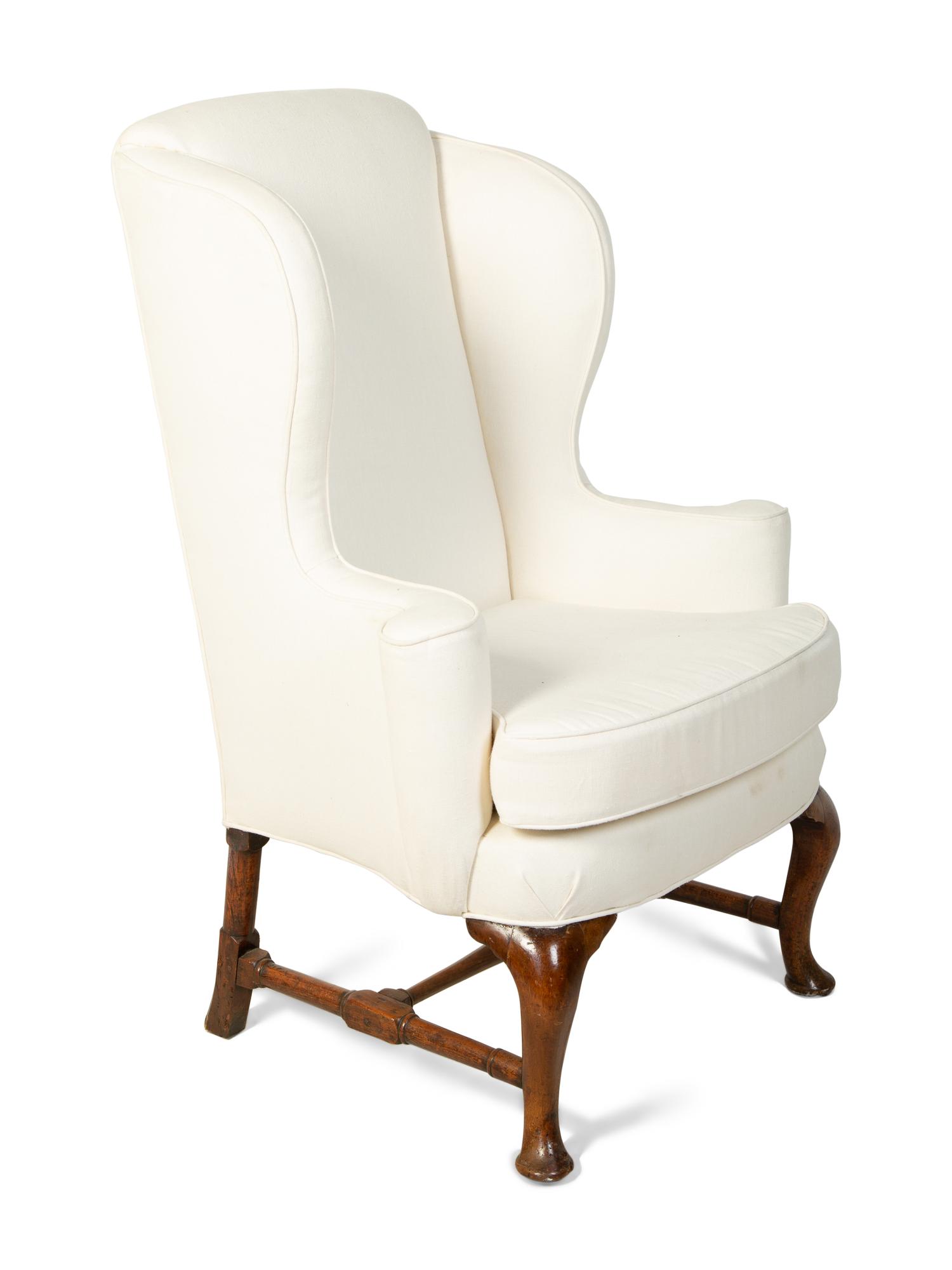 A Queen Anne Style Wingback Armchair — 18TH CENTURY