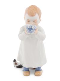 A Meissen Porcelain Figure of a Boy Drinking From a Blue Onion Bowl