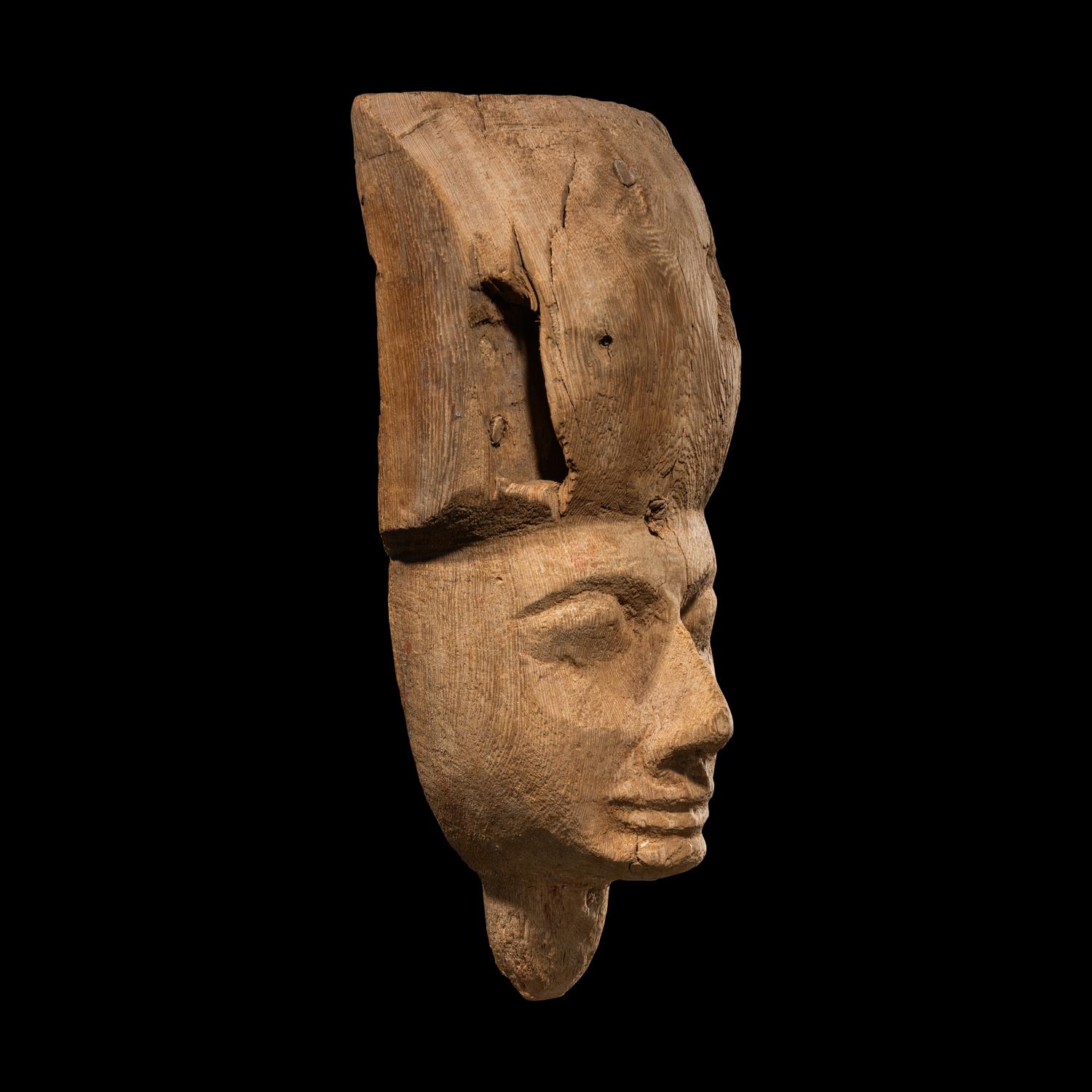 An Egyptian Wood Sarcophagus Mask