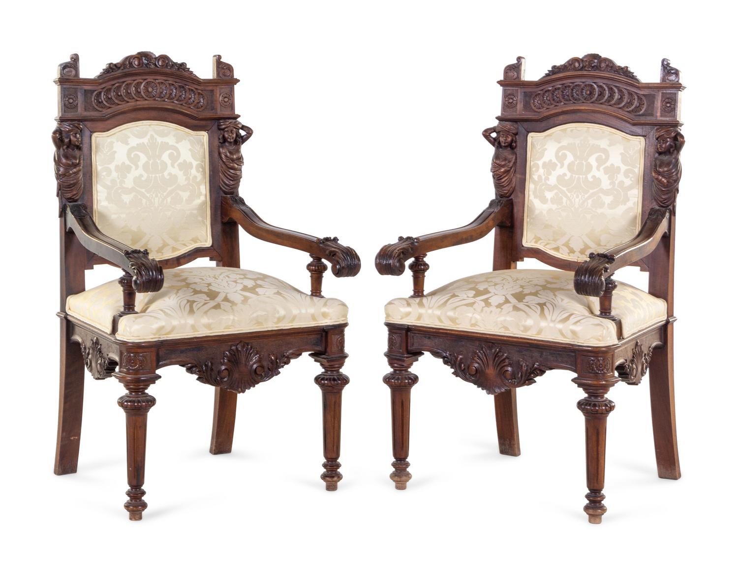 A Pair of French Renaissance Revival Carved Walnut Armchairs