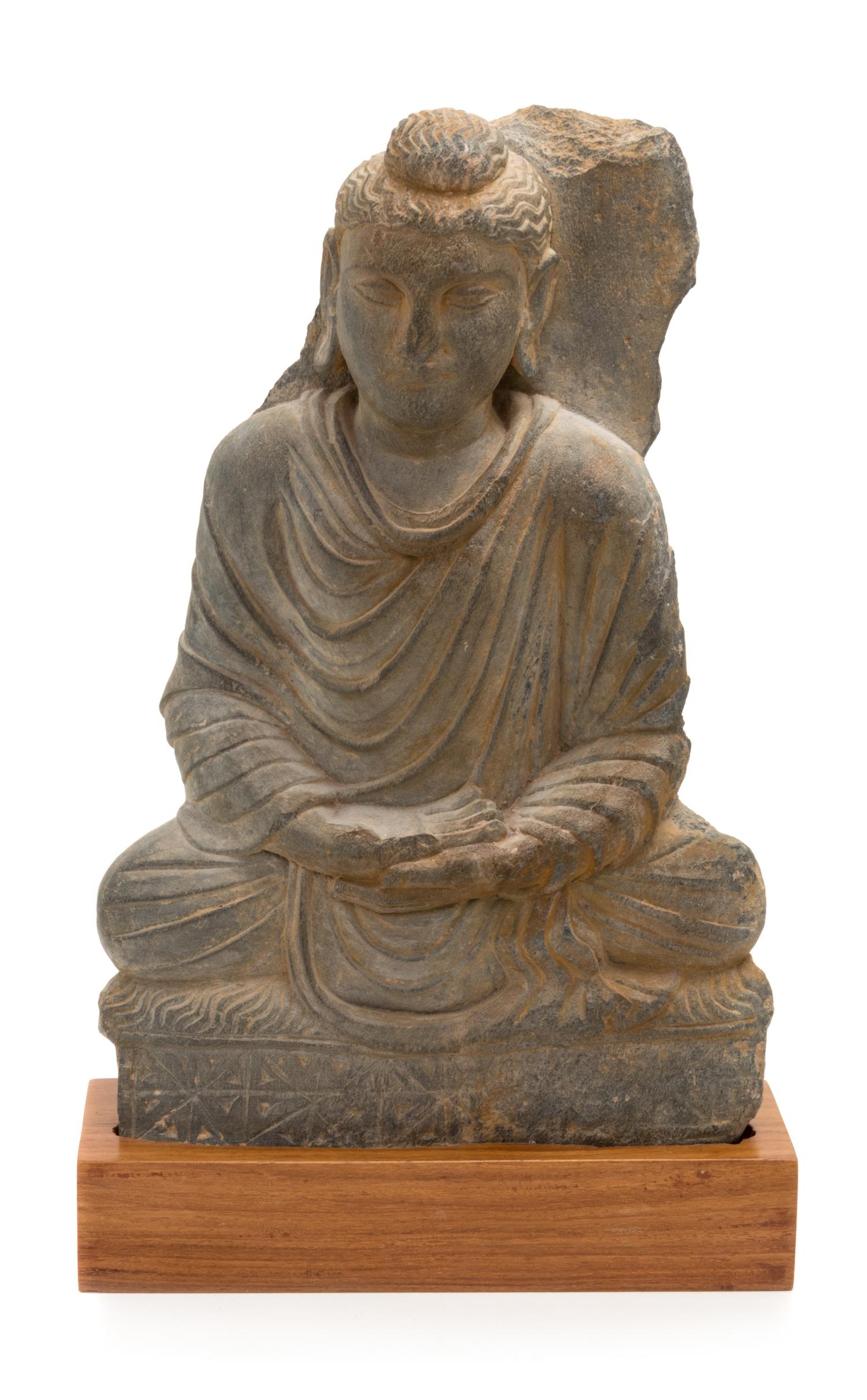 A Gandharan Gray Schist Figure of Seated Buddha Height 15 1/4 inches. — PROBABLY 2ND/3RD CENTURY
