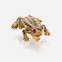 A fourteen karat gold, diamond, emerald, and ruby brooch