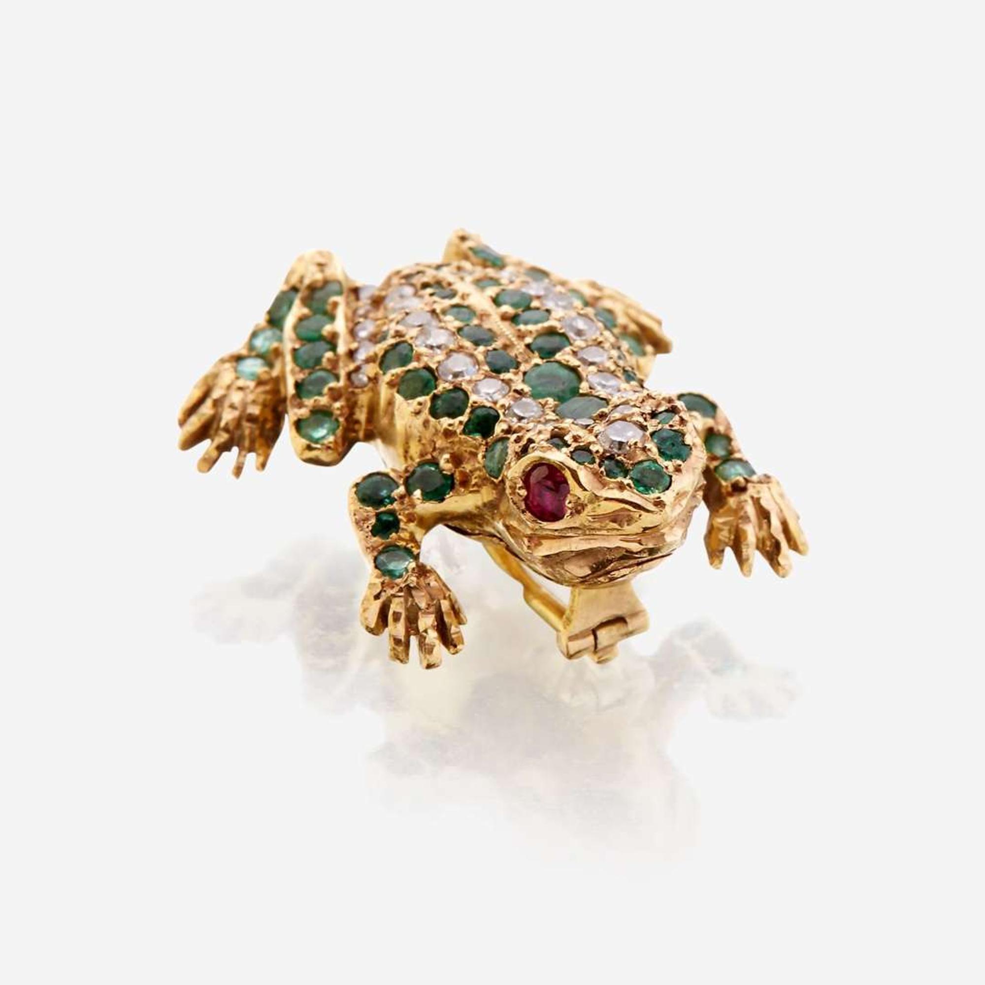A fourteen karat gold, diamond, emerald, and ruby brooch